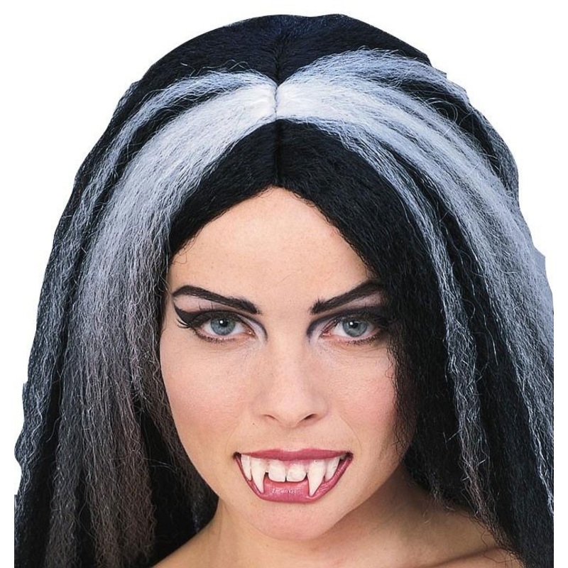 Vampire teeth. False teeth. Long, pointed